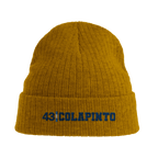 f111 merch mustard-yellow color beanie with colapinto branding.