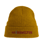 f111 merch mustard-yellow color beanie with hamilton branding.